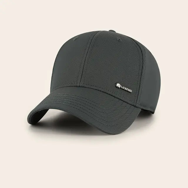 Lackpard No. 03 Technical cap in charcoal, with a small metal badge.
