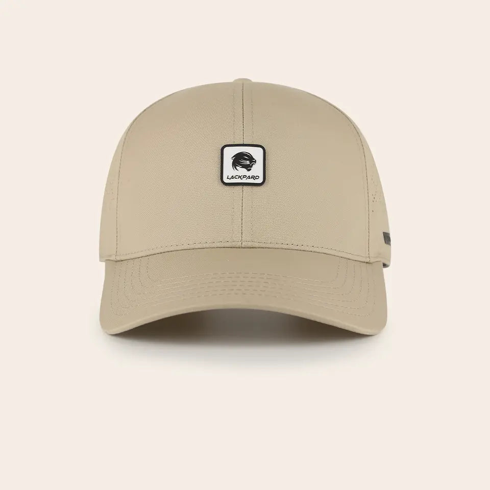 Lackpard No. 04 Perforated cap in sand, with a leopard head patch.